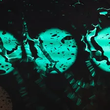 a close up of a traffic light in the rain related to Illuminate Your Nights: The Allure of Glow in the Dark Bedding