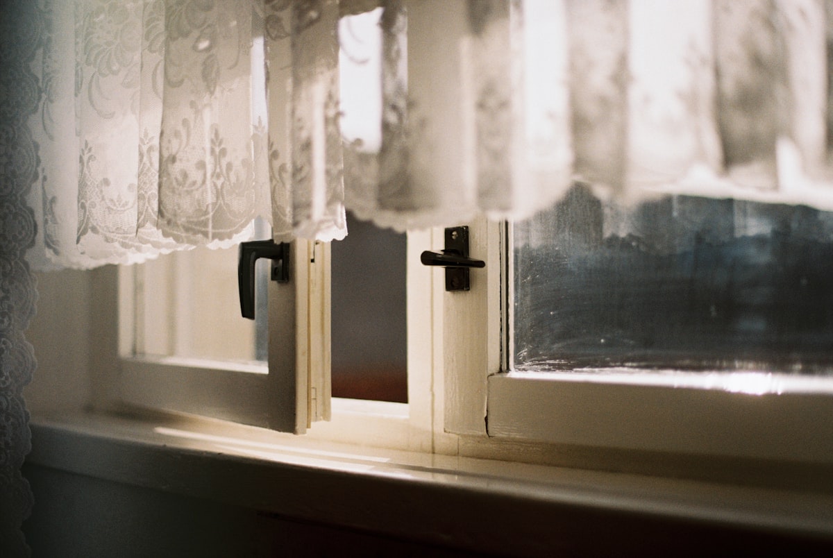 a close up of a window with a curtain related to A Step-by-Step Guide to Sewing a Window Valance