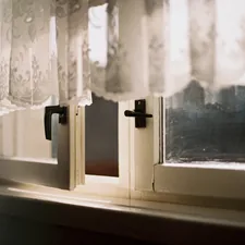 a close up of a window with a curtain related to A Step-by-Step Guide to Sewing a Window Valance