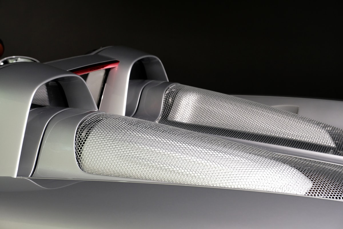 a close up of the front of a sports car related to Unleash the Racer: Ultimate Twin Speedster Bed for Kids
