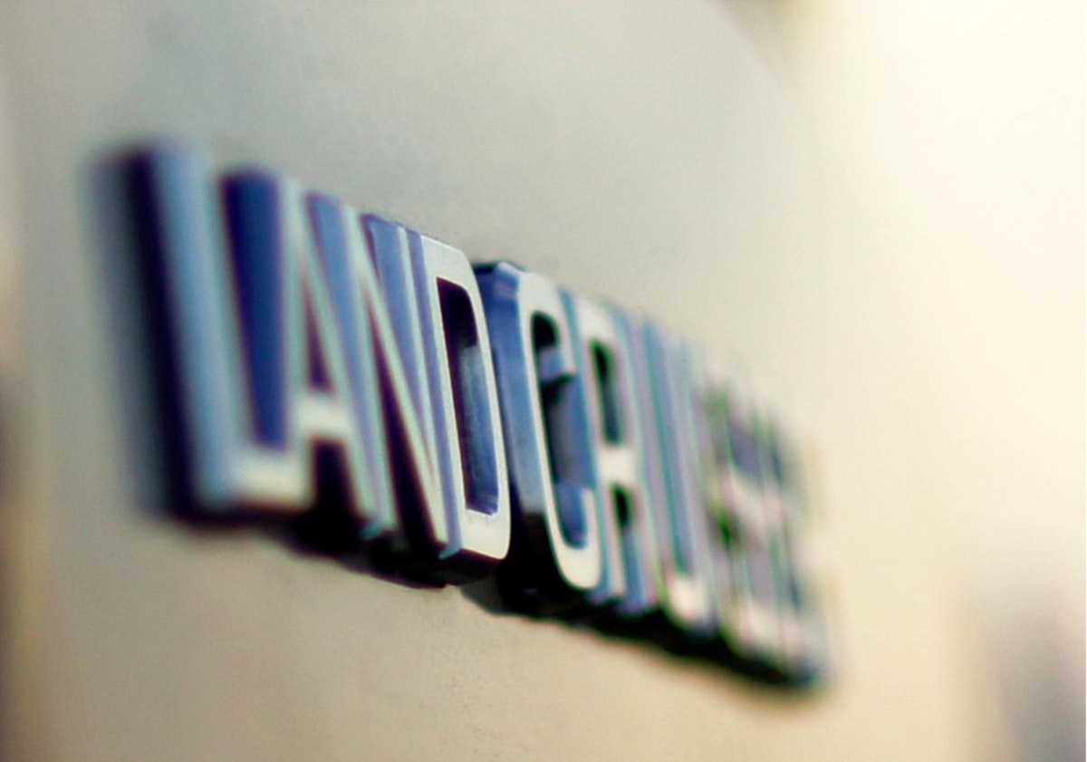 a close up of the name of a car related to The Luxurious World of Ann Gish Bedding: Elevate Your Sleep Experience