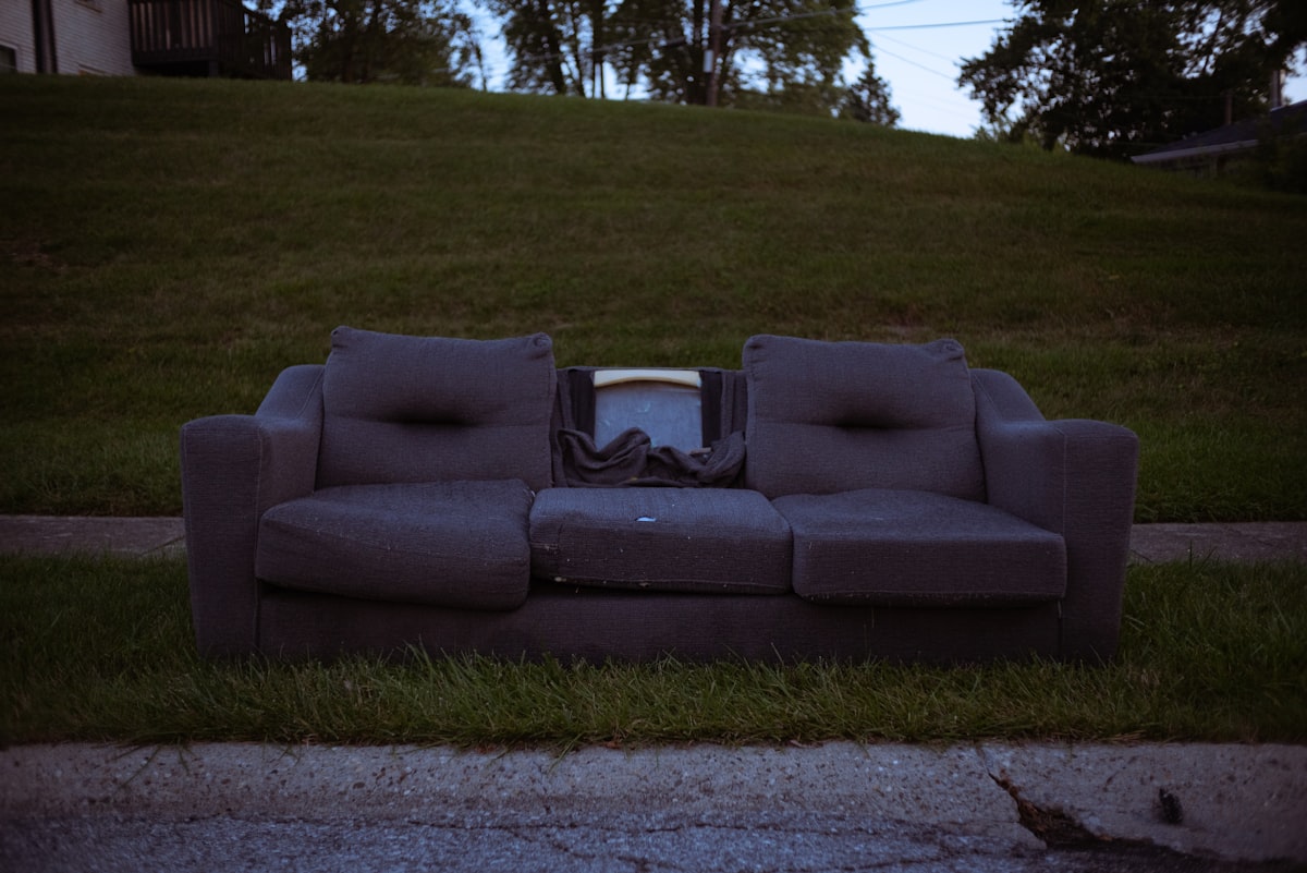 a couch sitting on the side of a road related to The Ultimate Space-Saving Solution: A Couch That Turns Into A Bunk Bed