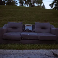 a couch sitting on the side of a road related to The Ultimate Space-Saving Solution: A Couch That Turns Into A Bunk Bed