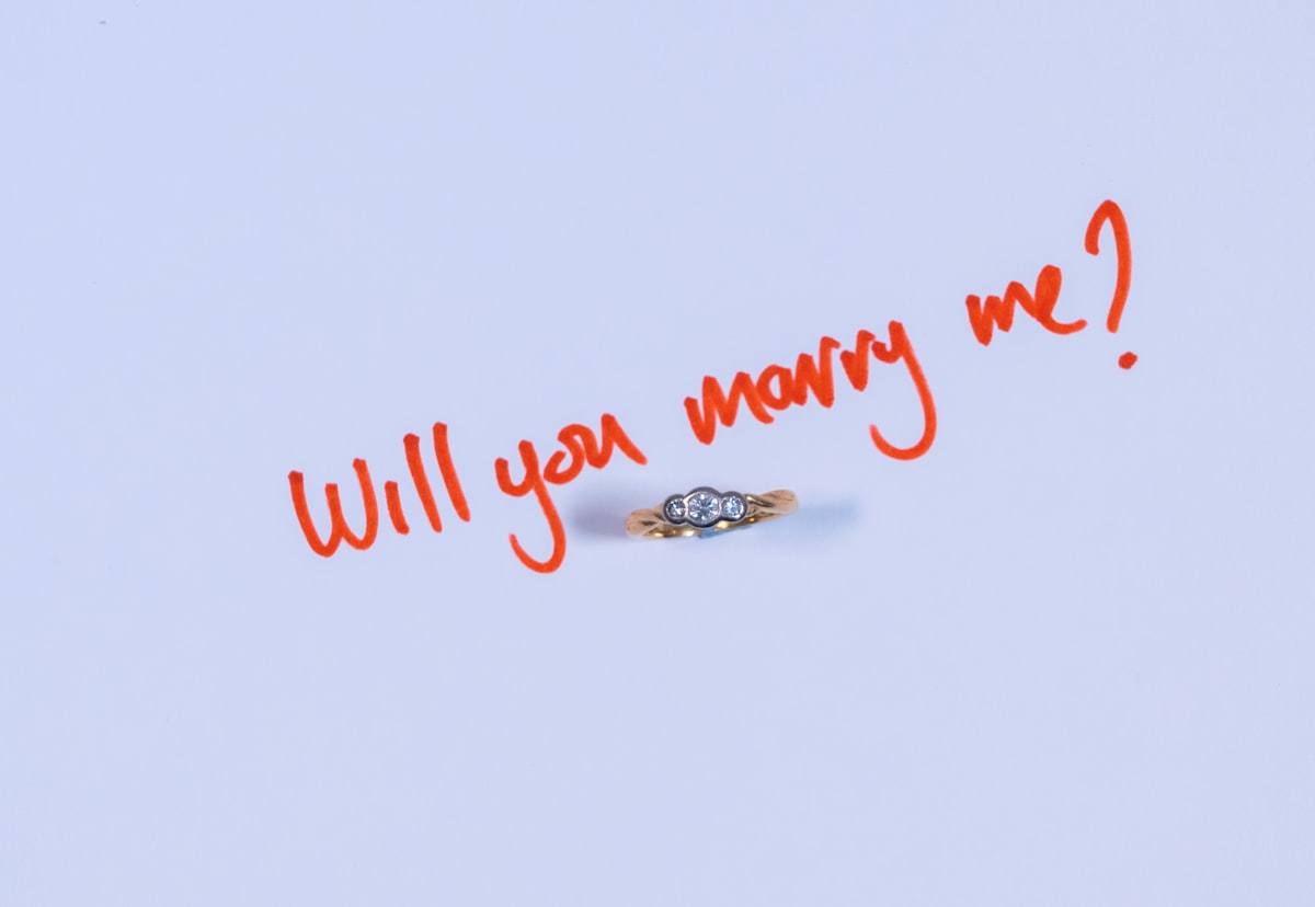 a couple of rings sitting on top of a piece of paper related to How to Please My Wife in Bed: A Guide to Deeper Connection and Intimacy