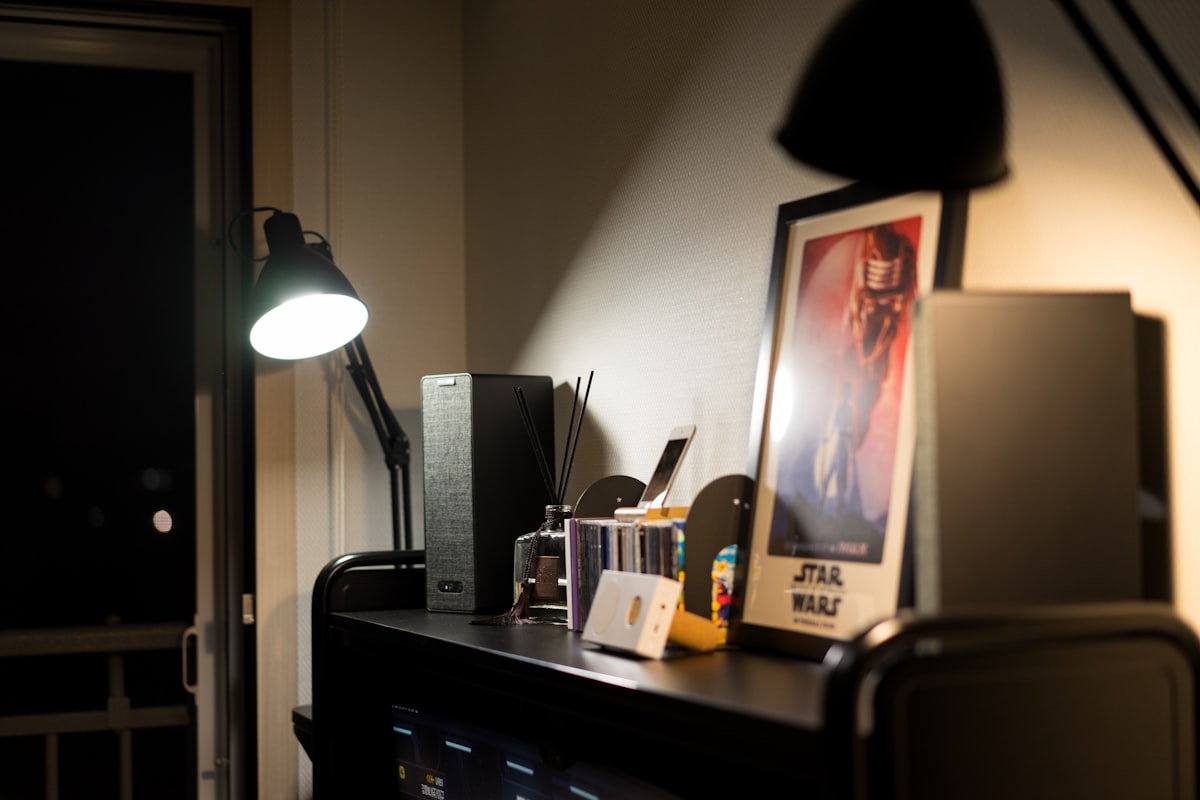a desk with a lamp and a picture on it related to Breathe New Life into IKEA Bjursta