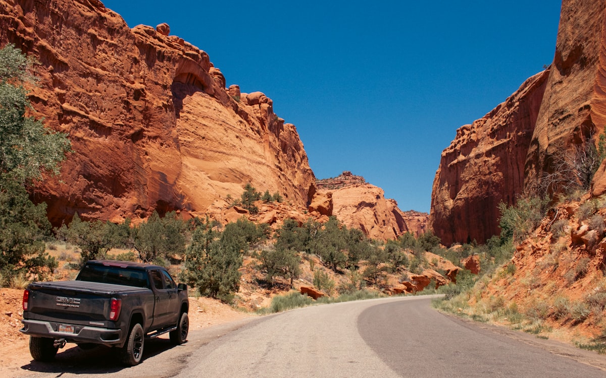 A GMC Truck is parked on the side of the Burr Trail road outside the Signing Canyon in Grand Staircase Escalante National Monument. It is a very scenic drive that continues on into Capitol Reef Park and Glen Canyon. related to Exploring the GMC Canyon Bed Dimensions