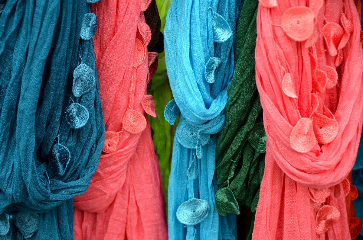 a group of colorful feathers related to Effortlessly Hang a Scarf Valance on a Curtain Rod