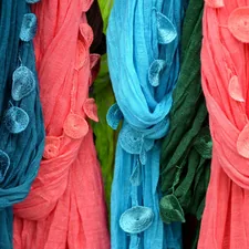 a group of colorful feathers related to Effortlessly Hang a Scarf Valance on a Curtain Rod