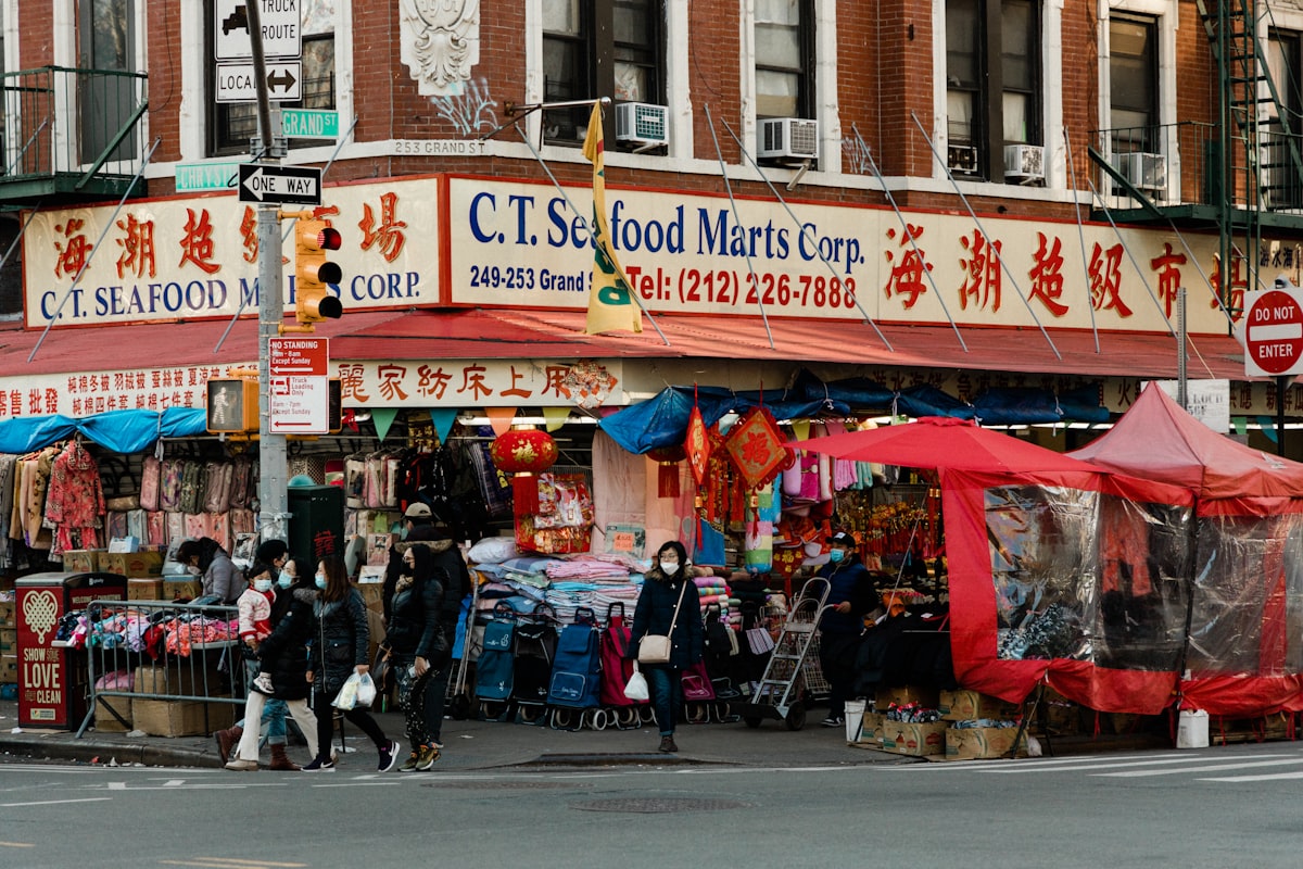 a group of people standing outside of a store related to Effective Solutions for Bed Bug Infestation in New York City
