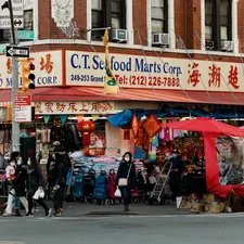 a group of people standing outside of a store related to Effective Solutions for Bed Bug Infestation in New York City