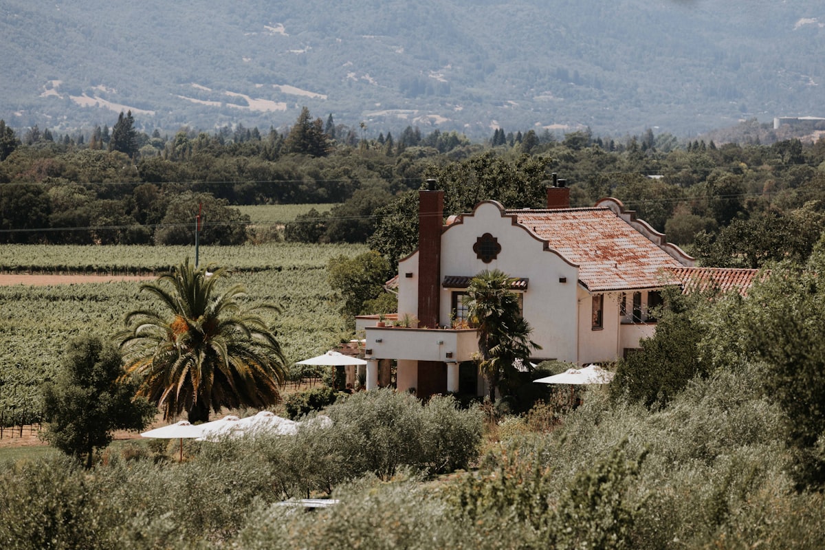 a house surrounded by trees related to Escape to Paradise: Napa Valley Bed and Breakfast