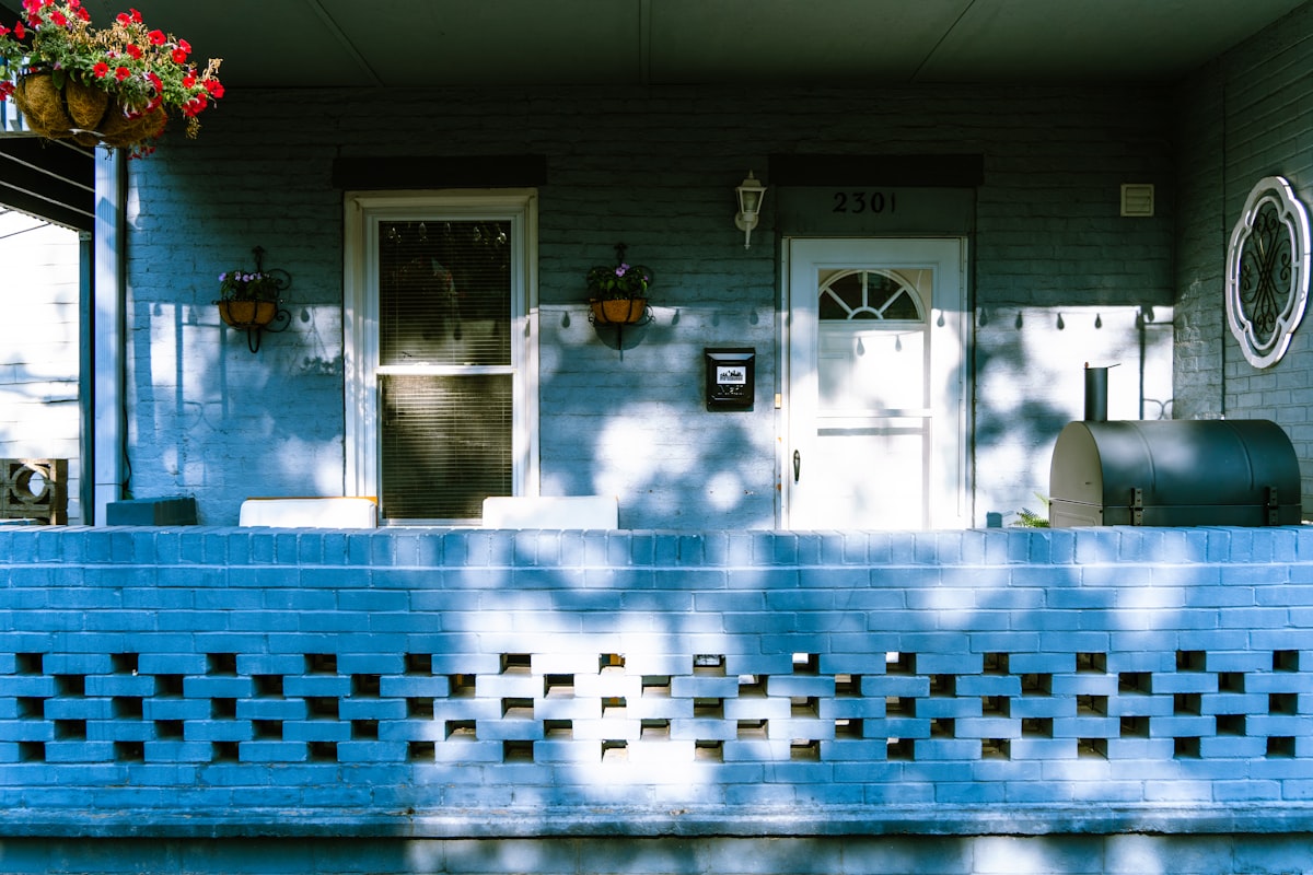 A house with a blue front porch and a white door related to Exploring the Charm of Bed and Breakfasts in Pennsylvania