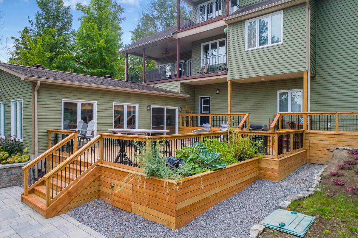 a house with a deck related to Cedar Raised Garden Beds: A Guide to Sustainable Gardening