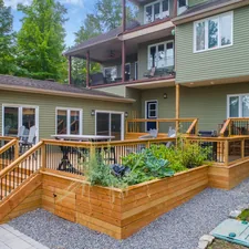 a house with a deck related to Cedar Raised Garden Beds: A Guide to Sustainable Gardening