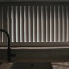 a kitchen sink with a faucet next to a window related to Window Valances for Kitchen: Elevate Your Window Style
