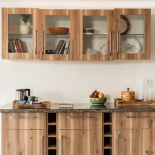 a kitchen with wooden cabinets and a bowl of fruit related to Enhance Your Home Decor with a Sideboard with Glass Doors