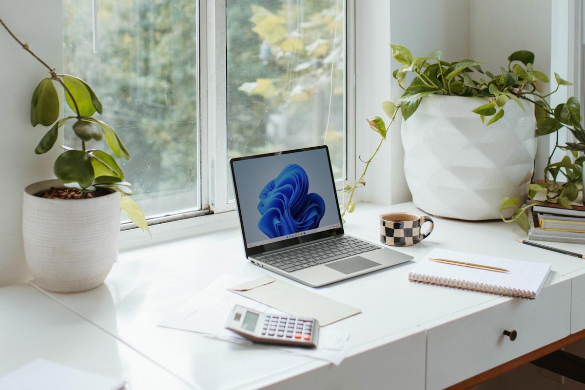 a laptop on a desk related to Elevate Your Windows on a Budget: Cheap Curtain Valances to Transform Your Space