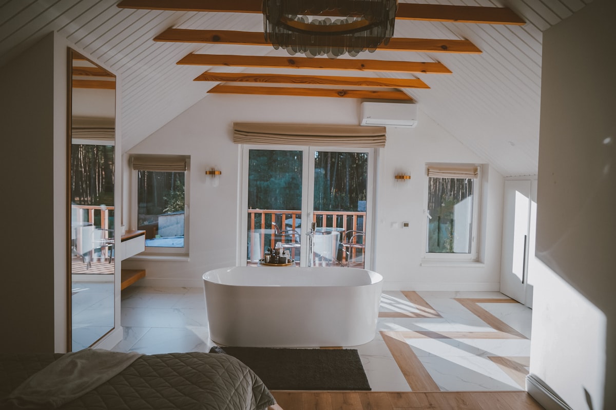 a large bathroom with a tub and a large window related to Exploring the World of Bed Bath & Beyond