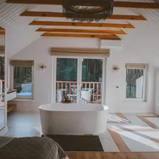 a large bathroom with a tub and a large window related to Exploring the World of Bed Bath & Beyond