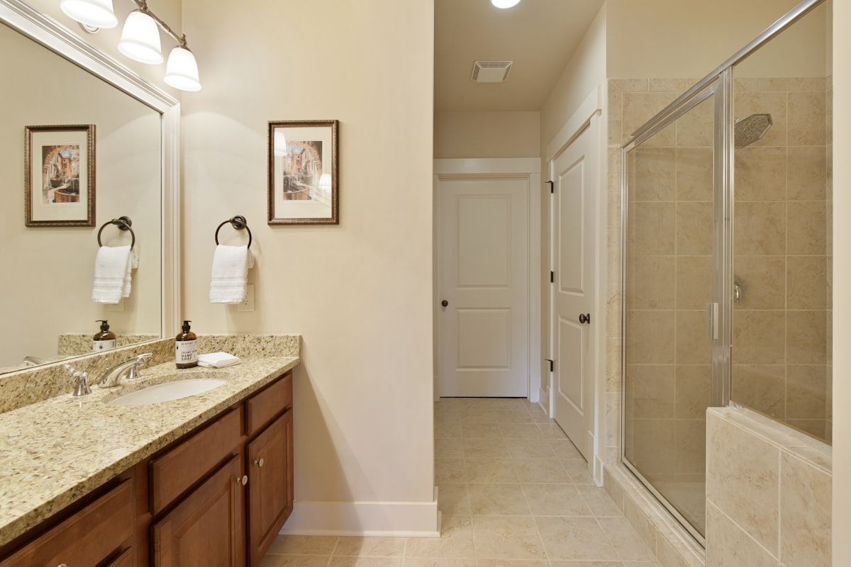 A large bathroom with a walk in shower related to Exploring the Perfect Home Layout