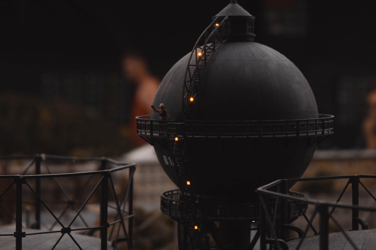 a large black object with some lights on top of it related to Chiminea vs Fire Pit: Choosing the Perfect Outdoor Fireplace