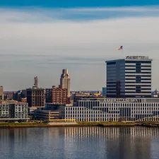 a large body of water with a city in the background related to Philadelphia's Bed Bug Epidemic: Causes and Consequences