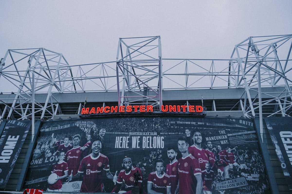a large sign on the side of a building related to Ultimate Manchester United Bedding: A Dream for Every Fan