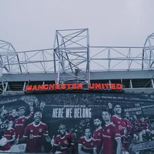 a large sign on the side of a building related to Ultimate Manchester United Bedding: A Dream for Every Fan