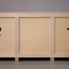 A large wooden crate with shipping symbols. related to Savvy Budgeting: Chic and Affordable Sideboard Cabinets