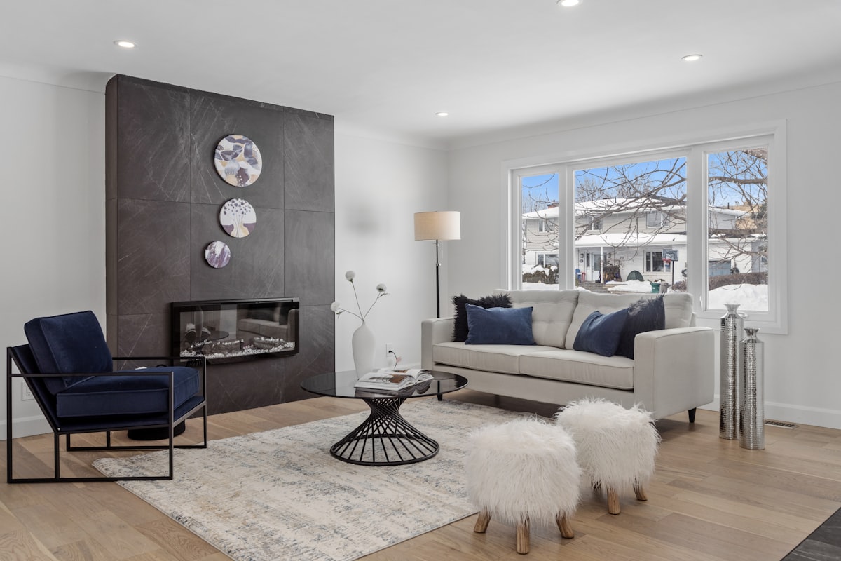 a living room filled with furniture and a fire place related to Cozy Haven: Navy and Grey Crib Bedding Essentials