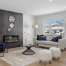 a living room filled with furniture and a fire place related to Cozy Haven: Navy and Grey Crib Bedding Essentials