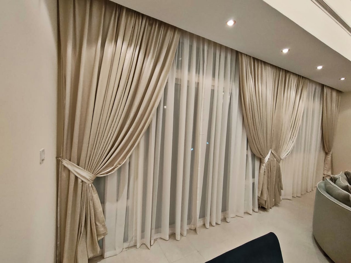 a living room filled with furniture and curtains related to JCPenney Drapes and Valances