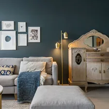 A living room filled with furniture and pictures on the wall related to Small Mirrored Sideboards for Compact Spaces