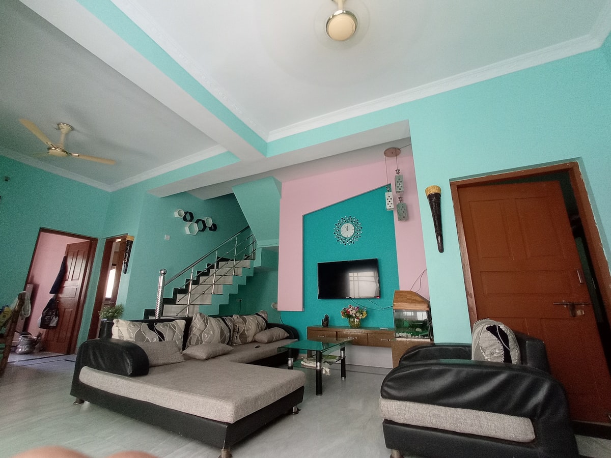 a living room with a couch and a tv related to Discover the Perfect 2 Bed House Rentals for You