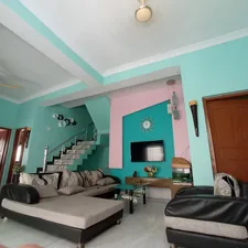 a living room with a couch and a tv related to Discover the Perfect 2 Bed House Rentals for You