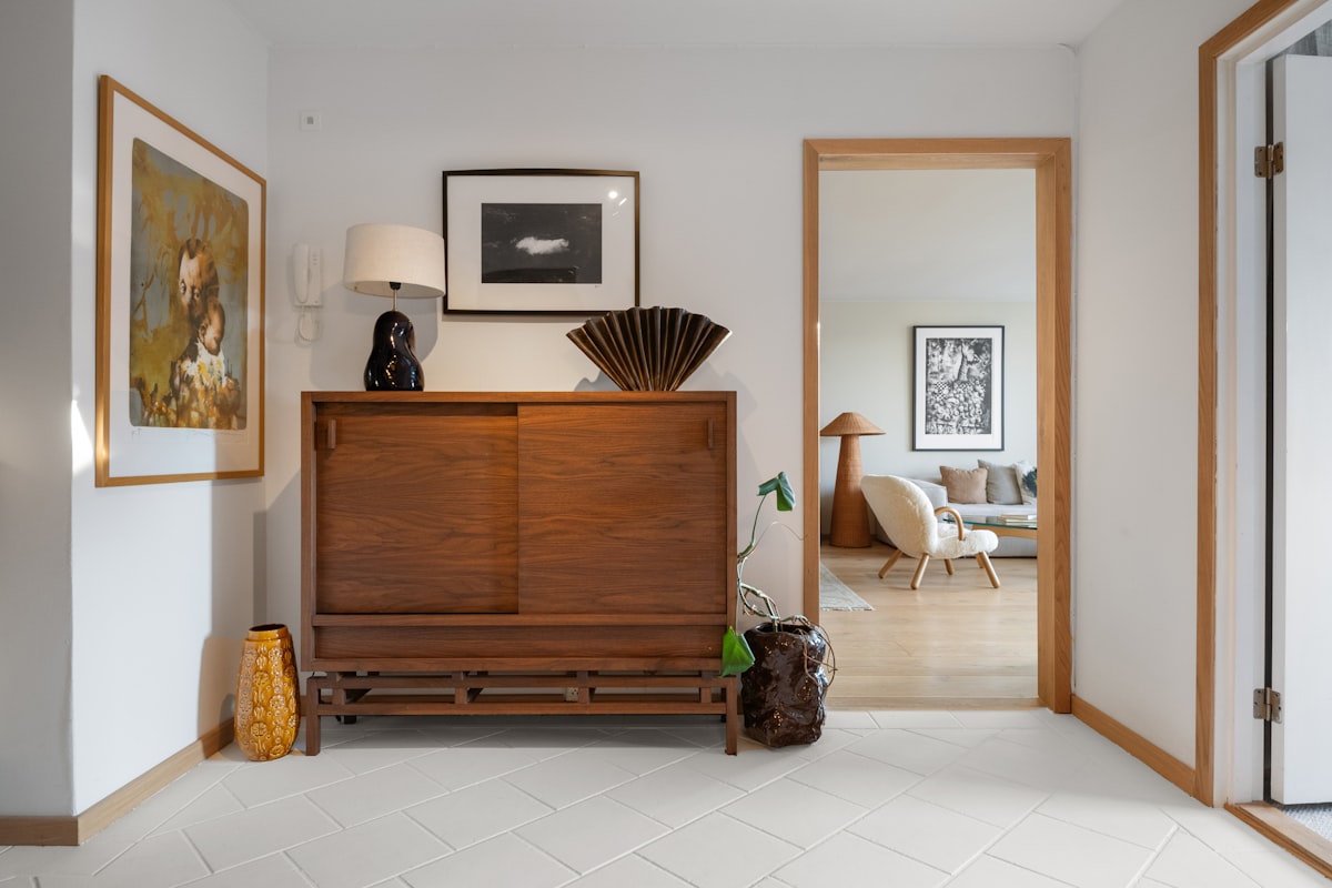 A living room with a dresser and a mirror related to Art Deco Sideboard - Timeless Masterpiece