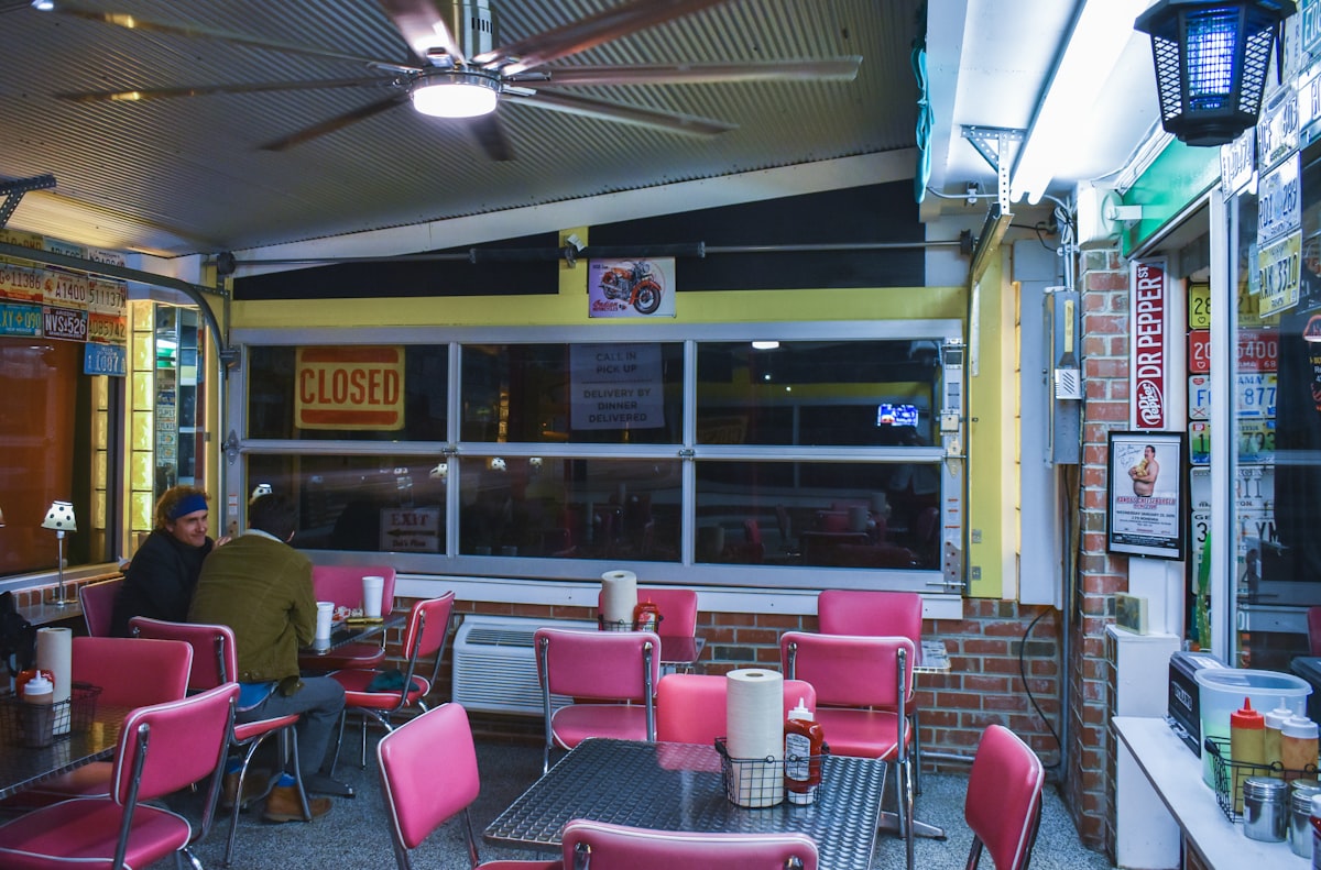 a man sitting at a table in a restaurant related to Discover the Charm of Bed and Breakfasts in Chattanooga