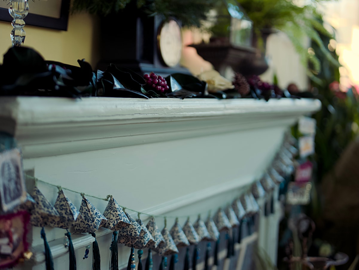 a mantle with a bunch of items on top of it related to Homemade Valance Ideas