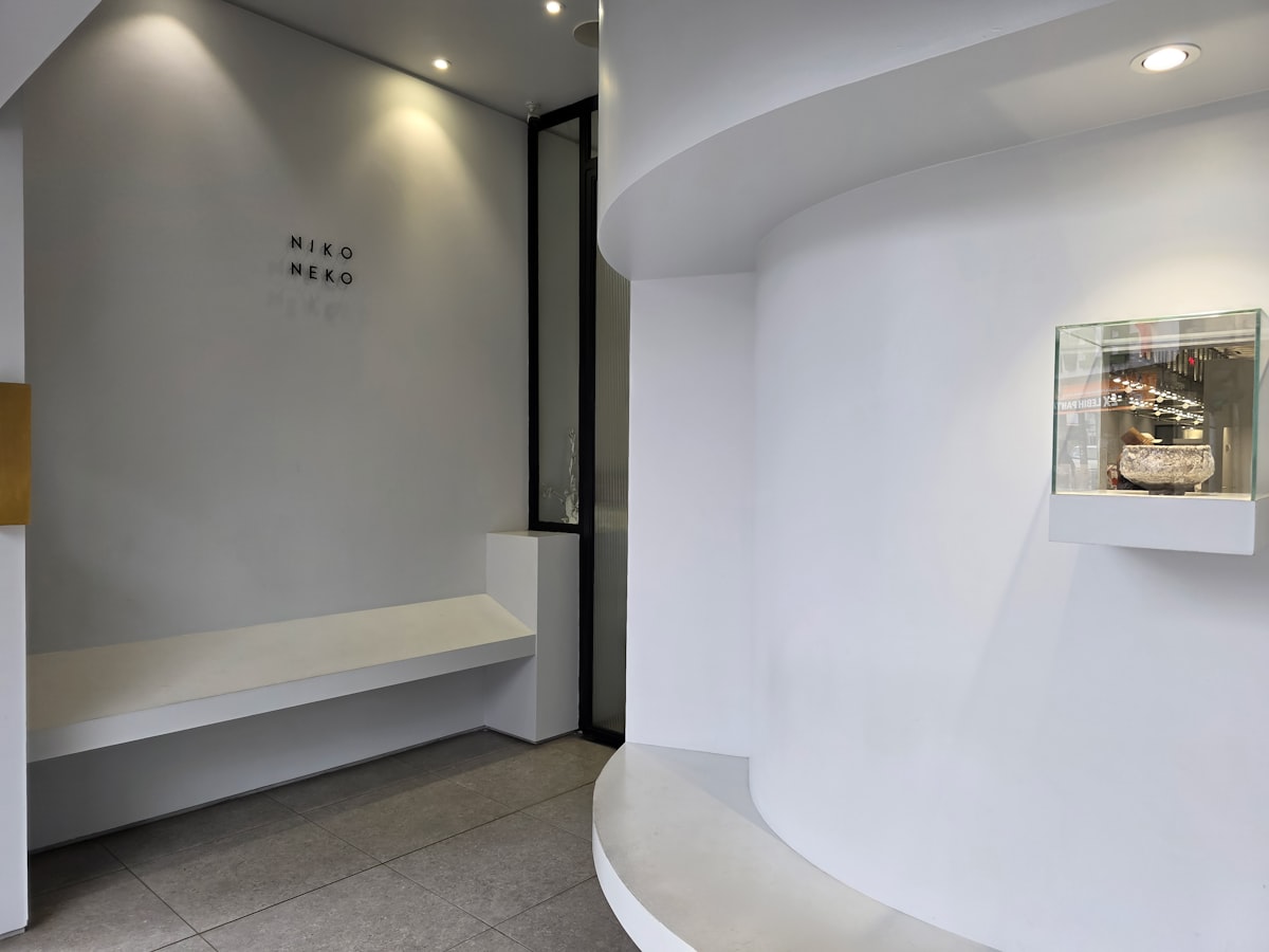 A modern, minimalist interior with clean white walls. related to Revamping Your Home with Corner Entryway Benches
