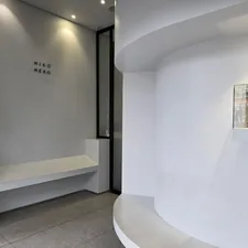 A modern, minimalist interior with clean white walls. related to Revamping Your Home with Corner Entryway Benches