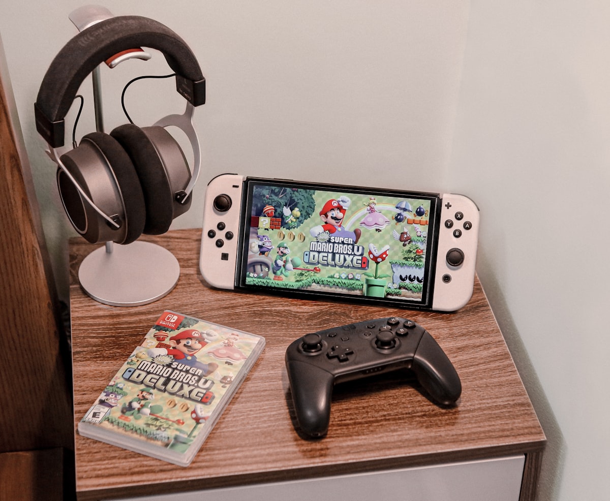 a nintendo wii game system sitting on top of a wooden table related to Transform Your Bedroom with a Nintendo Bed Set: A Gamer's Dream