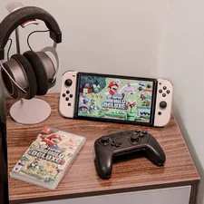 a nintendo wii game system sitting on top of a wooden table related to Transform Your Bedroom with a Nintendo Bed Set: A Gamer's Dream