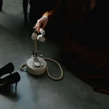 a pair of black high heeled shoes sitting on the floor related to Revitalize Your Wardrobe: The Ultimate Guide to Clothes Steamers from Bed Bath & Beyond