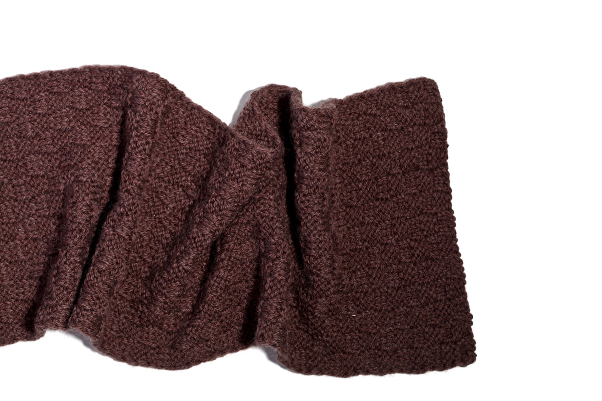 A pair of brown cloths on a white background related to The Timeless Elegance of the Brown Matelasse Coverlet