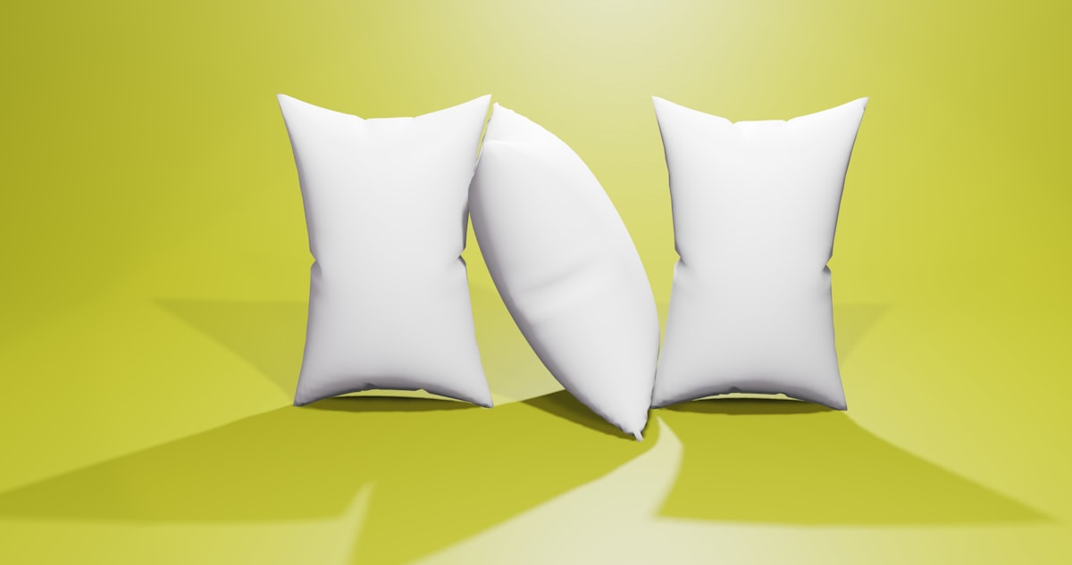 a pair of white pillows sitting on top of a green floor related to The Comforting Bliss of Home: Bed Lounge Pillows Explained
