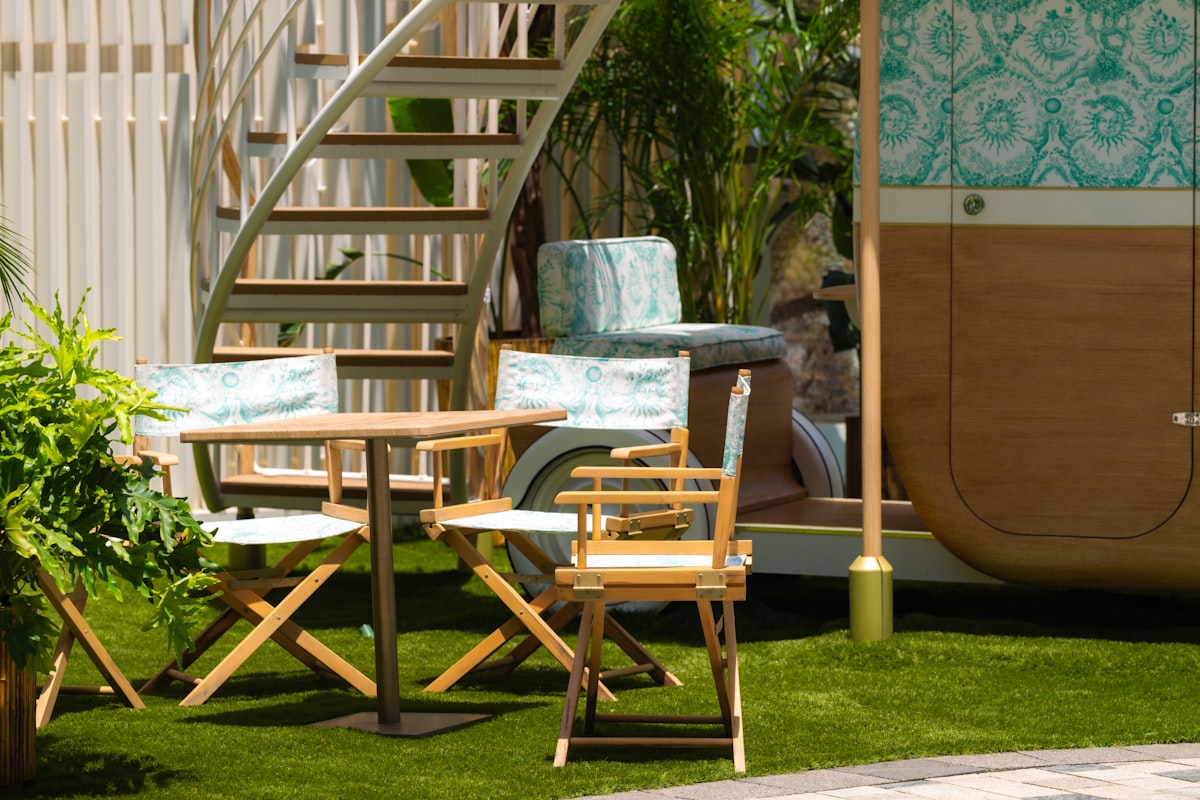 A patio with a table, chairs, and a staircase related to Exploring Outdoor Furniture Options at Bed Bath & Beyond