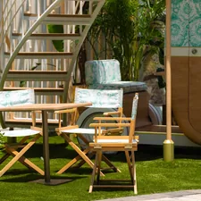 A patio with a table, chairs, and a staircase related to Exploring Outdoor Furniture Options at Bed Bath & Beyond