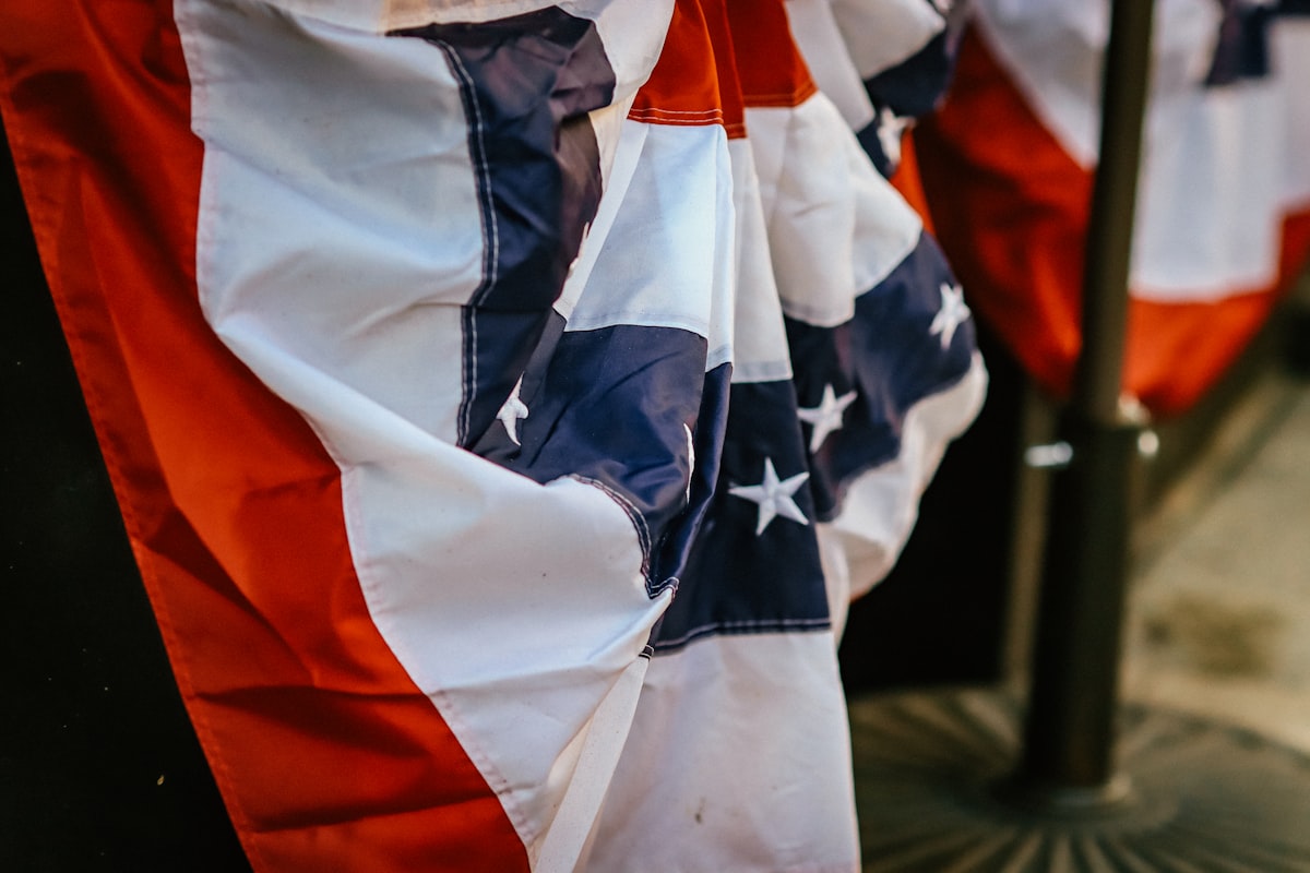 A patriotic bunting adorns a pole. related to The Divisive Symbol of Comfort: A Controversial Look at Confederate Flag Bedding