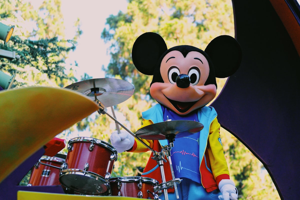 a person in a garment playing drums related to Mickey Mouse Valence Curtains