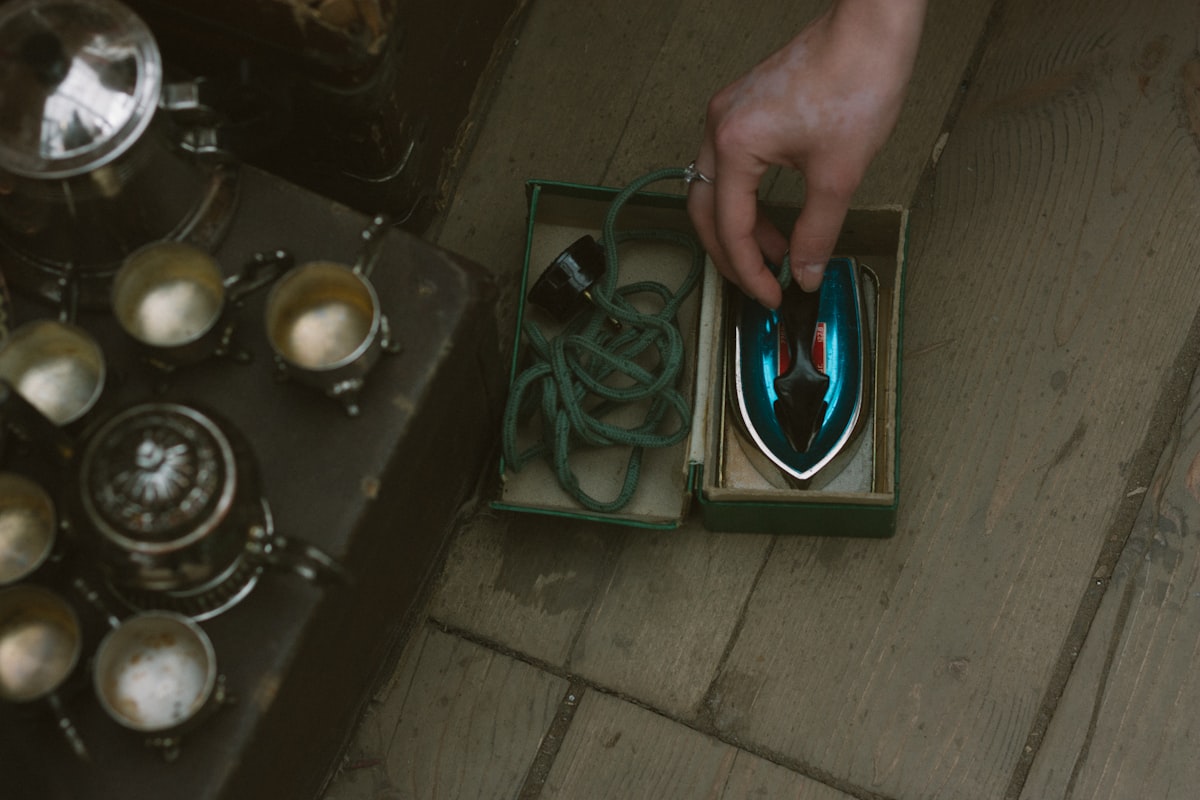 a person is holding a mouse in a box related to The Ultimate Guide to Choosing Bed Bath & Beyond Irons: What You Need to Know